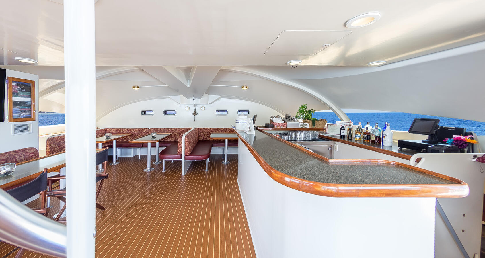 8 Granite Tables and Cushioned Seating Main Salon