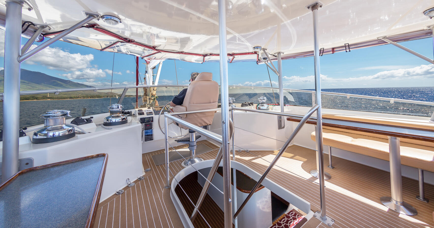 Third Deck Fly Bridge with Panoramic Ocean Views and 2 Dining Tables Seating for 12 Guests